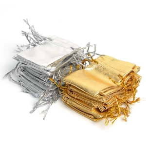Bulk gold and silver metallic drawstring gift bags for jewelry packaging and storage