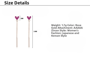 Macro detail of rose gold heart tassel earrings with dimensions 8mm by 54mm