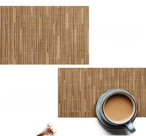 Close-up of brown PVC placemat showing woven texture, heat resistance and hemmed edges