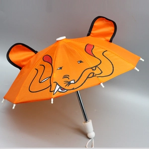 Detail of 18 inch doll umbrella in orange with elephant print and cute 3D ears design