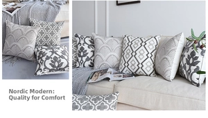 Détail de housses de coussin brodées géométriques nordiques sur canapé en gris et blanc