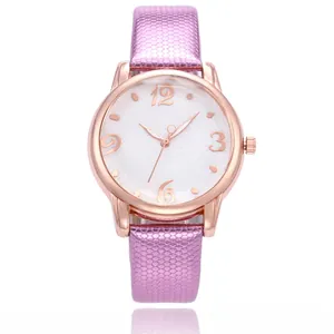Detail of rose gold quartz watch featuring floral white dial and purple textured strap