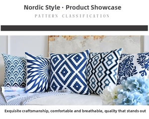 Macro view of blue and white towel embroidery with geometric patterns on a cushion cover