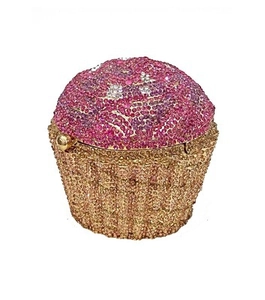 Exquisite cupcake clutch bag with pink and gold crystals on a hollow metal frame