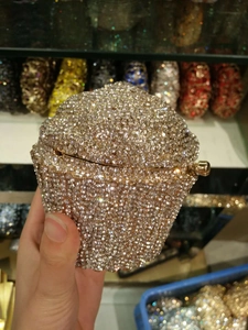 Detailed close-up of cupcake-shaped evening bag featuring champagne gold crystal rhinestones