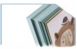 Detail of vintage sky blue photo frame showing precise 45-degree corner cutting process
