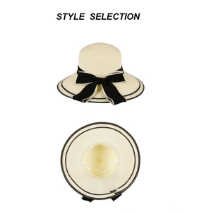 Détail d'un chapeau de paille à large bord avec nœud noir et vue intérieure