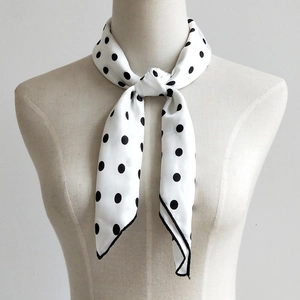 Elegant polka dot satin neck scarf for women featuring a black and white knotted design