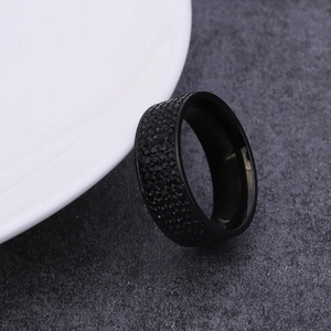 Wide black stainless steel band ring encrusted with five rows of black sparkling crystals
