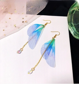 Detail of gradient gauze butterfly wing earrings with colorful crystal drop pendants
