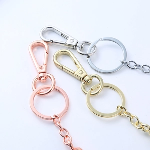 Detailed view of metal keychain hooks and rings in rose gold, gold, and silver finishes