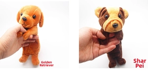 Detail showing Golden Retriever and Shar-Pei plush dog pencil cases in hand
