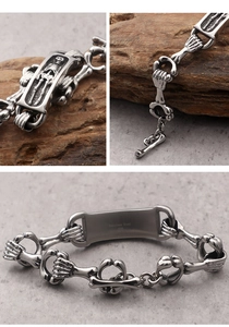 Macro shot of 316L stainless steel skull bracelet showing gothic details and engraving