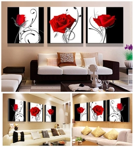 Three-piece wall art set featuring red roses with black and white scroll patterns