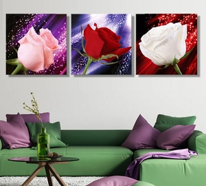 Three-piece wall art set featuring detailed pink, red and white roses with water droplets
