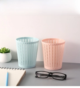 Detail of pink and blue hollow plastic desk organizers for office stationery and sundries