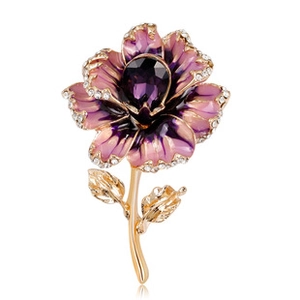 Detail of vintage flower brooch with purple enamel petals and white rhinestones inlay