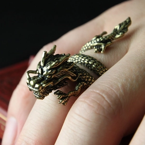 Vintage bronze dragon wrap ring featuring detailed carvings and adjustable open band