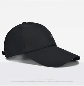 Detail view of cotton canvas baseball cap featuring decorative side label and fine texture