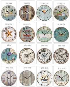 Collection of 16 vintage silent wall clocks featuring diverse nautical and floral designs