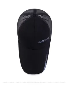 Detail view of the breathable mesh back and printed sports logo on a black baseball cap