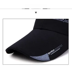 Detail of black peaked cap brim with SportStyle print and reinforced internal structure