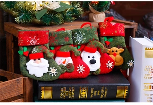 Set of 4 festive felt Christmas stockings featuring Santa, Snowman, Bear and Reindeer