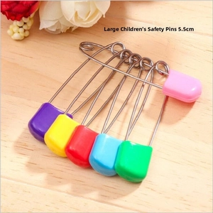 Detailed view of 5.5cm colorful safety pins with secure plastic heads for baby use