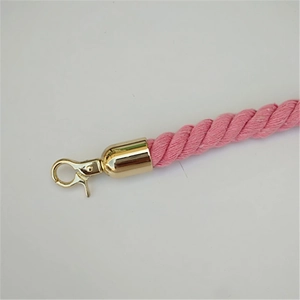 Detailed view of pink twisted cotton strap with polished gold metal lobster clasp hook
