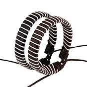 Close-up of dual woven leather punk bracelets in black and brown with adjustable cords