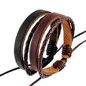 Close-up of four-piece braided leather bracelet set in black and brown tones
