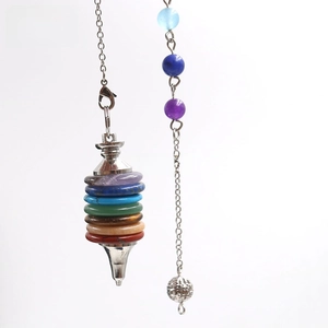 Close-up of stacked 7 chakra stones with silver metal cone tip and beaded chain