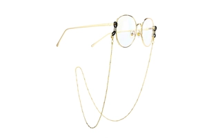 Detail of golden metal eyewear chain with silicone non-slip loops on glasses frame