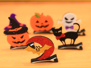 Detailed close-up of a 5-piece Halloween felt hair clip set with glitter pumpkin and ghost