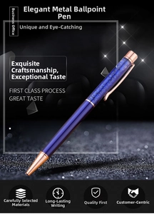 Detail of a blue executive metal ballpoint pen with rose gold accents and sparkle finish