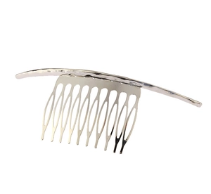 Detailed view of silver metal hair comb with hammer textured top and ten fine teeth