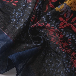Detailed close-up of floral print cotton linen scarf showing woven texture and patterns