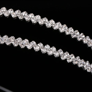 Close-up of elegant double-layered silver headband with sparkling crystal rhinestones