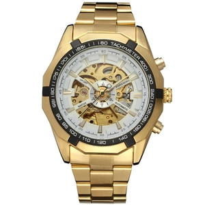Macro view of automatic skeleton watch featuring golden band and black tachymeter bezel