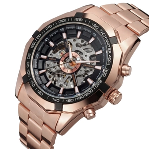 Close-up of rose gold automatic skeleton watch with visible inner gears and tachymeter