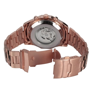 Macro view of mechanical watch movement through transparent case back and metal buckle