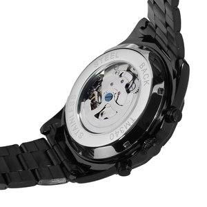 Detail view of transparent case back showing automatic mechanical movement of steel watch
