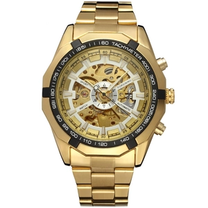 Detail of golden skeleton dial and black tachymeter bezel on automatic mechanical watch