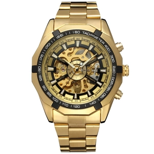 Macro shot of gold automatic watch dial showing intricate skeleton mechanical movement