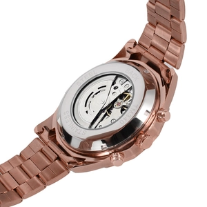 Macro detail of automatic mechanical movement through the transparent stainless steel case back