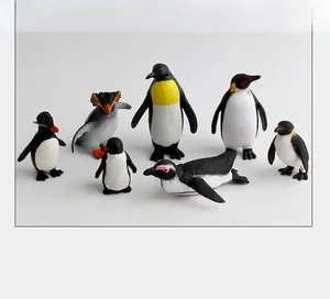 Detailed set of seven realistic penguin figurines in various life stages and poses