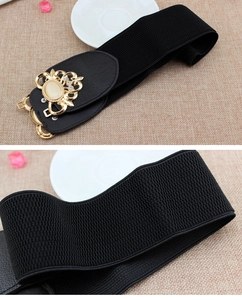 Detailed close-up of elastic waist belt with gold vintage buckle and opal inlay details