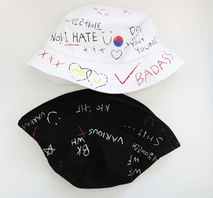 Graffiti bucket hat with street style heart patterns for sun protection in black and white