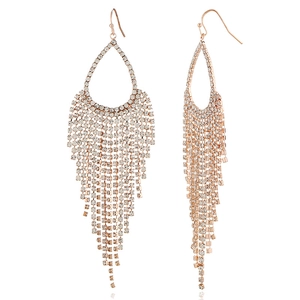 Close-up of rose gold tassel earrings with sparkling rhinestones in a drop design