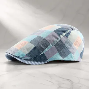 Blue-grey plaid newsboy cap in breathable cotton-linen blend with striped brim detail